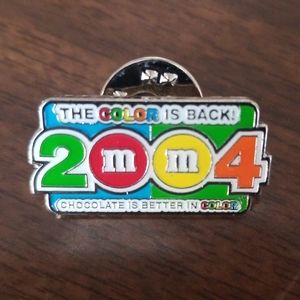 M& M 2004 Color is back lapel pin